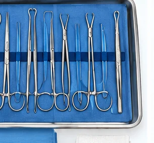 A complete spay kit laid out on a sterile drape in its tray